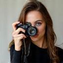 Olivia Grant headshot with camera